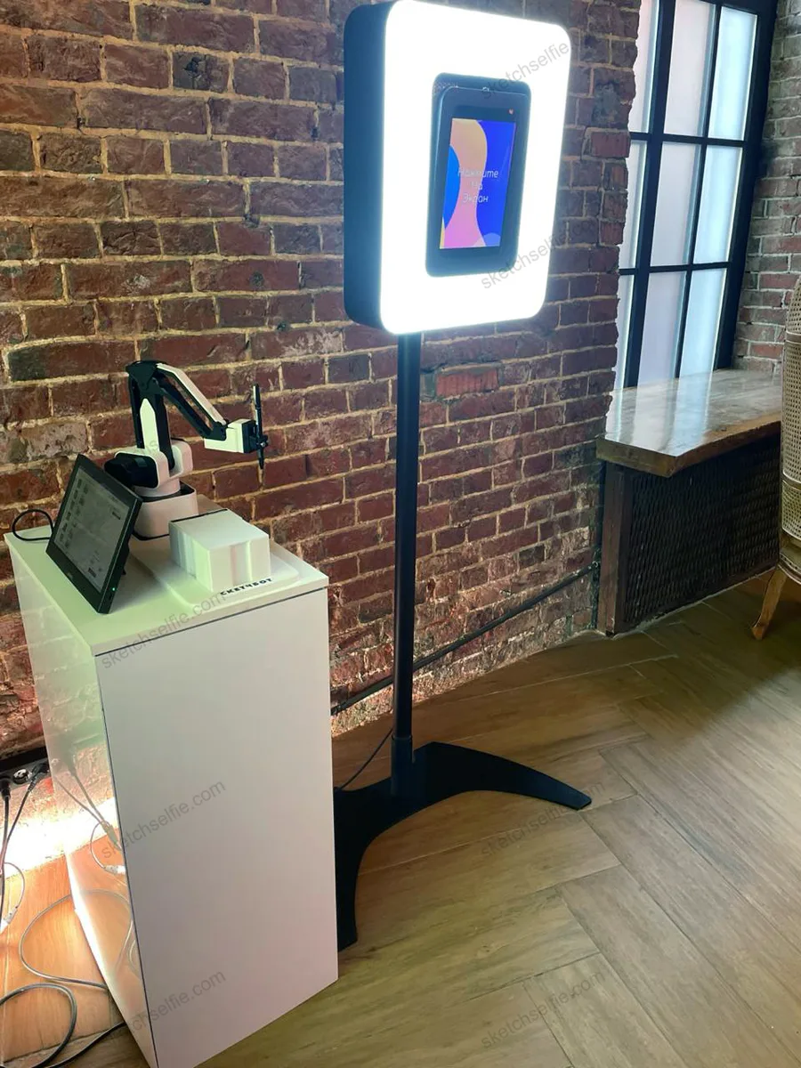 sketchbot at a party drawing portraits