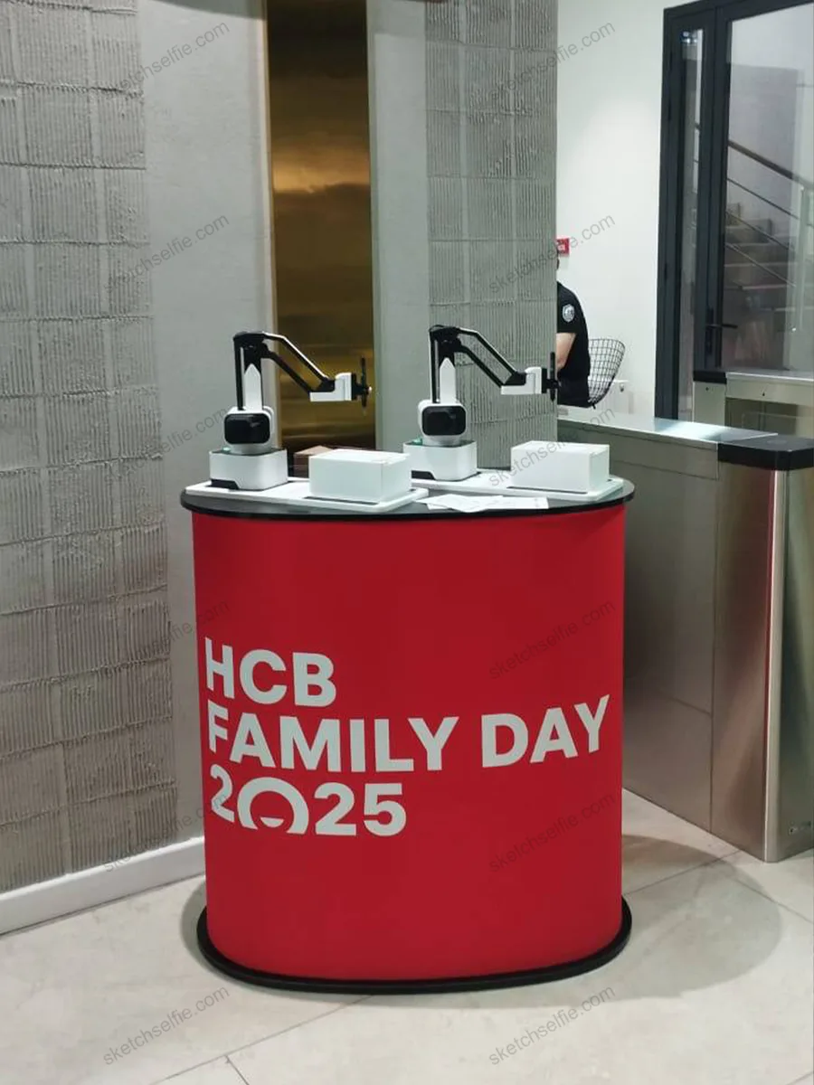 two sketchbot robots at trade show