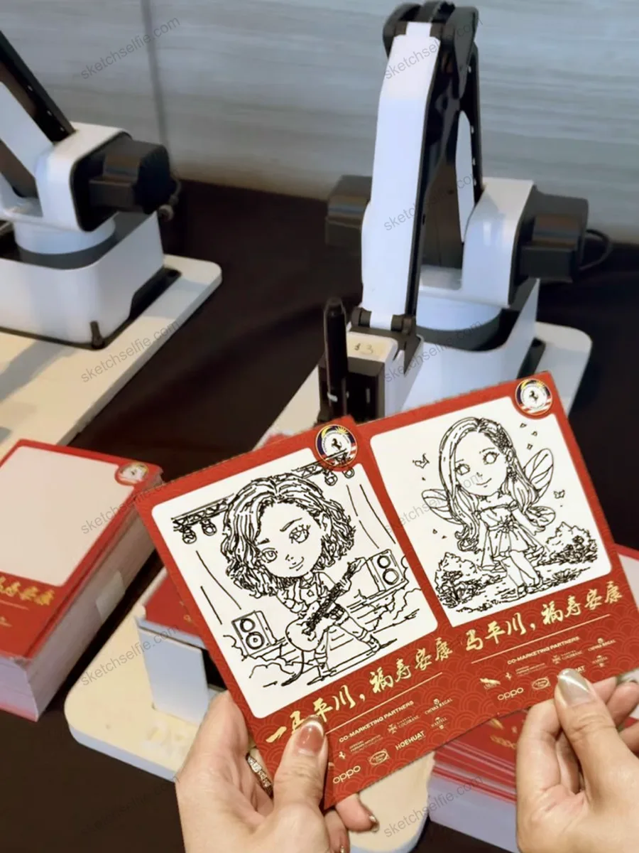 visitor holding two sketchbot caricatures